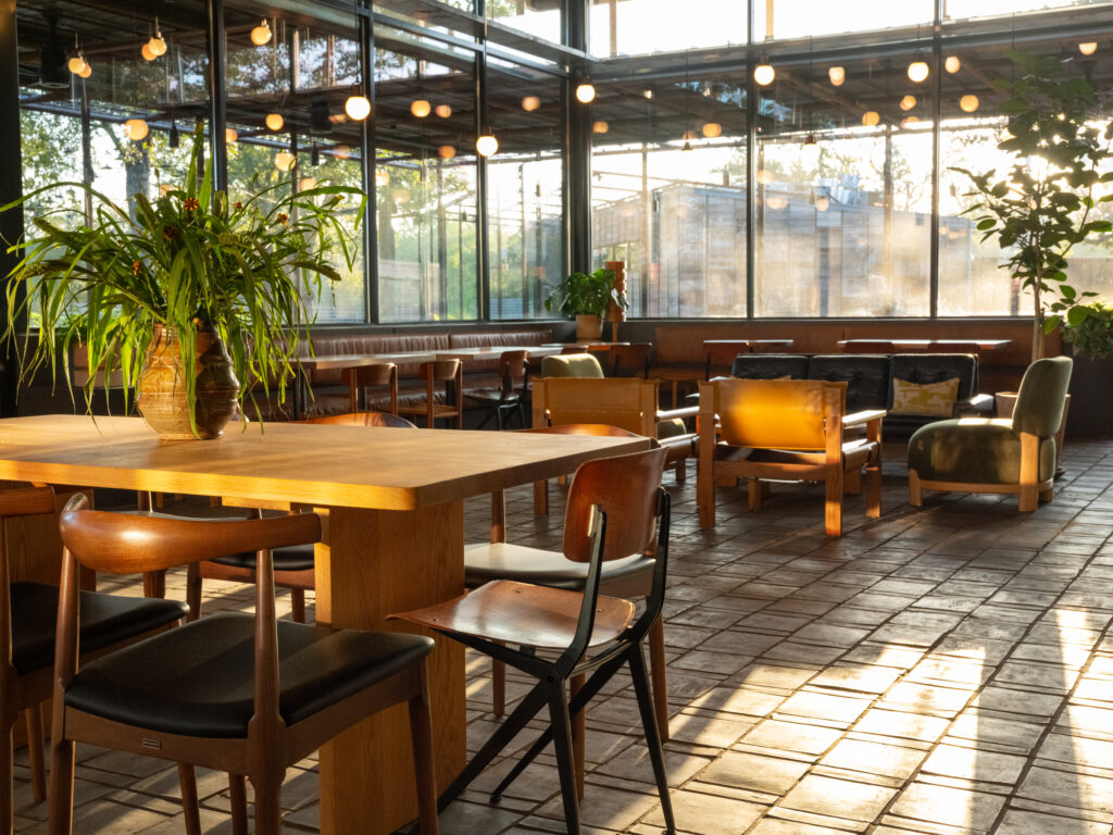 Designed by Austin architecture firm Clayton Korte, Leona Botanical Cafe & Bar draws inspiration from international outdoor food markets with an open-air setting that invites guests into the surrounding gardens.