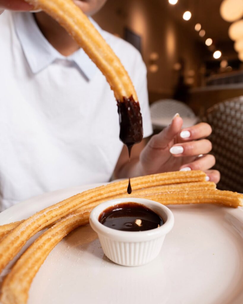 Sugar and cinnamon-coated churros from San Ginés Austin.