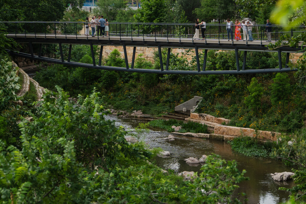 The Confluence includes an 800-foot boardwalk, three lattice pedestrian bridges and new gathering spaces along Waller Creek.