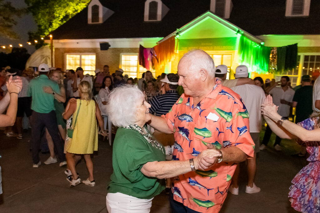 Marcia and Ron Macha dance to live music during the Muny Cup and 19th Hole Party