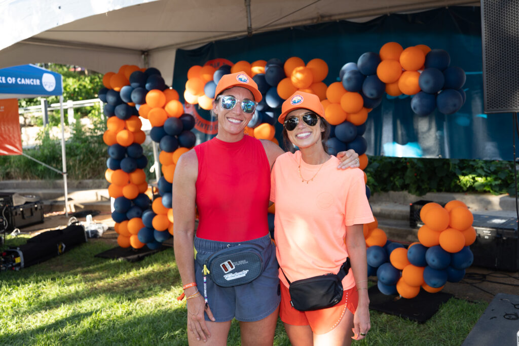 Chelsea Hardee, left, and Alyssa Cornett attend Flatwater’s Post-Paddle Party at the Lower Colorado River Authority’s Redbud Center on Monday, June 8, after the nonprofit’s 17th annual Dam That Cancer fundraiser on Lake Austin.