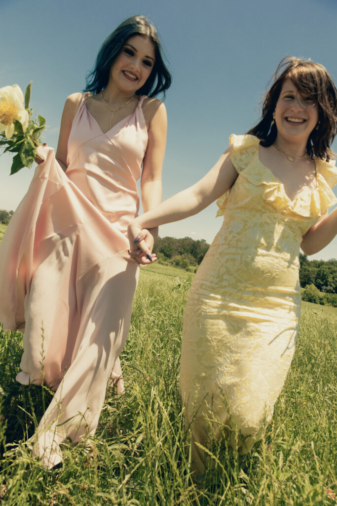Designers Millie Partin and Morgan McGaughey wear Alice + Olivia dresses with Kendra Scott jewelry.