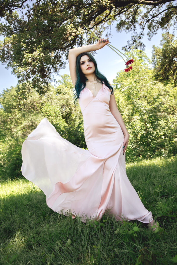 Designer Millie Partin wears an Alice + Olivia Andrina Maxi Dress in English Rose with a Kendra Scott Elisa and Abbie Strand Y Necklace.