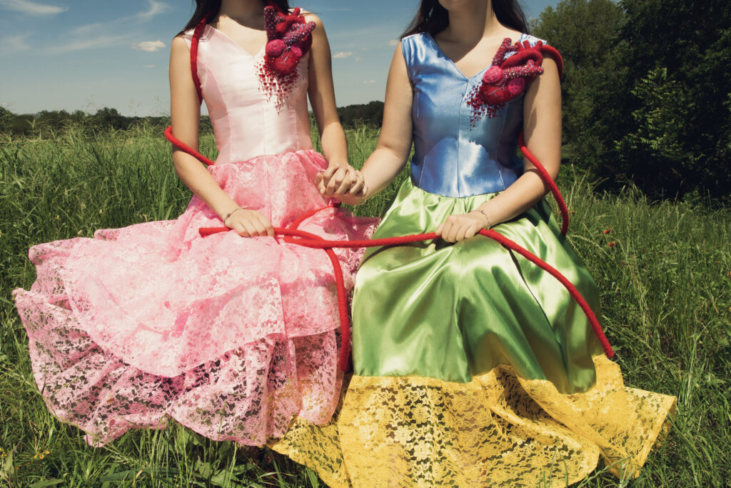 The student-designed collection features connected-heart details and hand-finished garments that reference Frida Kahlo’s painting “The Two Fridas.”