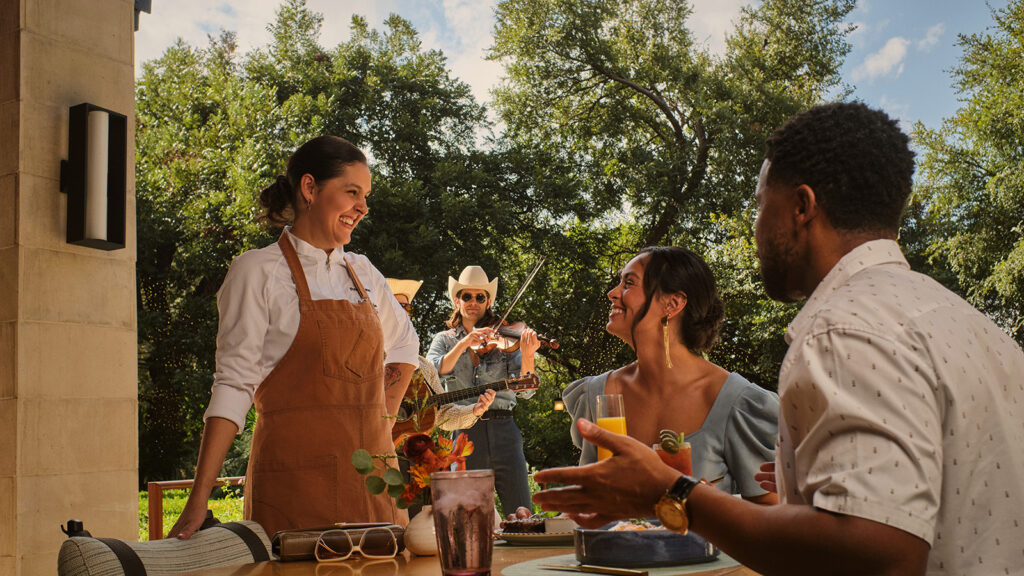 couple enjoying dinner on the patio of Four Seasons Austin.