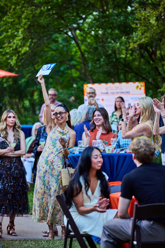Guests bid during the 2026 UMLAUF Garden Party, an annual fundraiser supporting the UMLAUF Sculpture Garden + Museum.