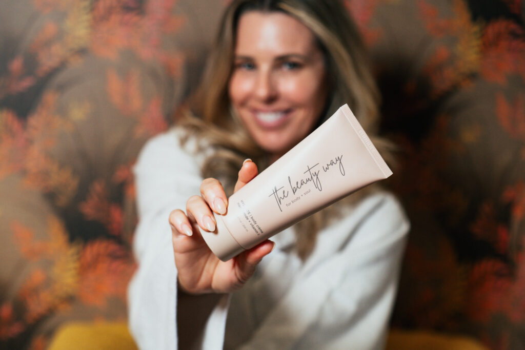 Founder of The Beauty Way holds her signature body creme.