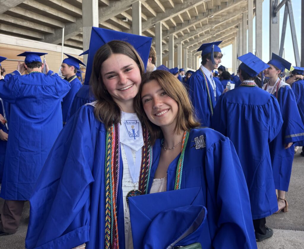 Maya Tackett, inagural TRIBEZA Austin Student Journalism Scholarship, stands next to Thea Clare Brosnan at her graduation. (Photo by Max Satterwhite)
