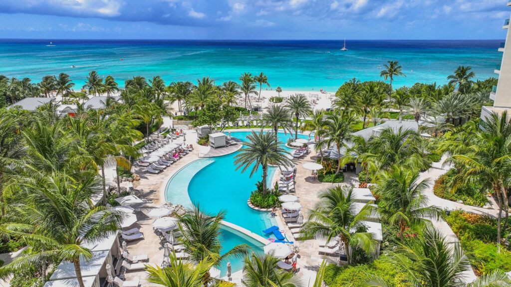 Pool situated next to Seven Mile Beach at Kimpton Seafire Resort + Spa