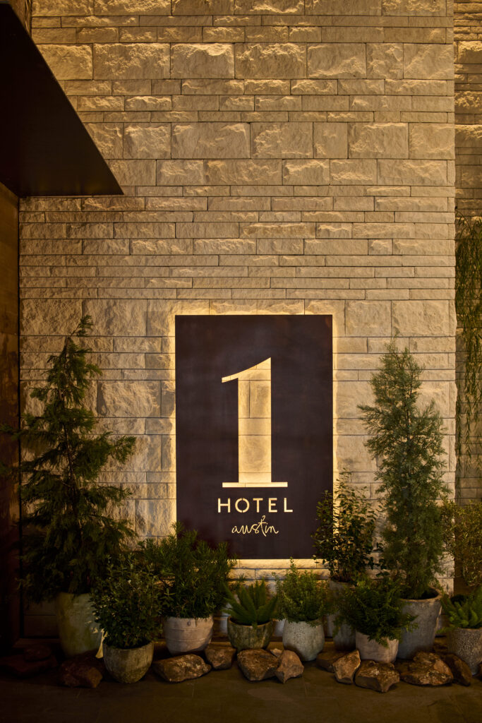 wall sign outside of 1 Hotel Austin
