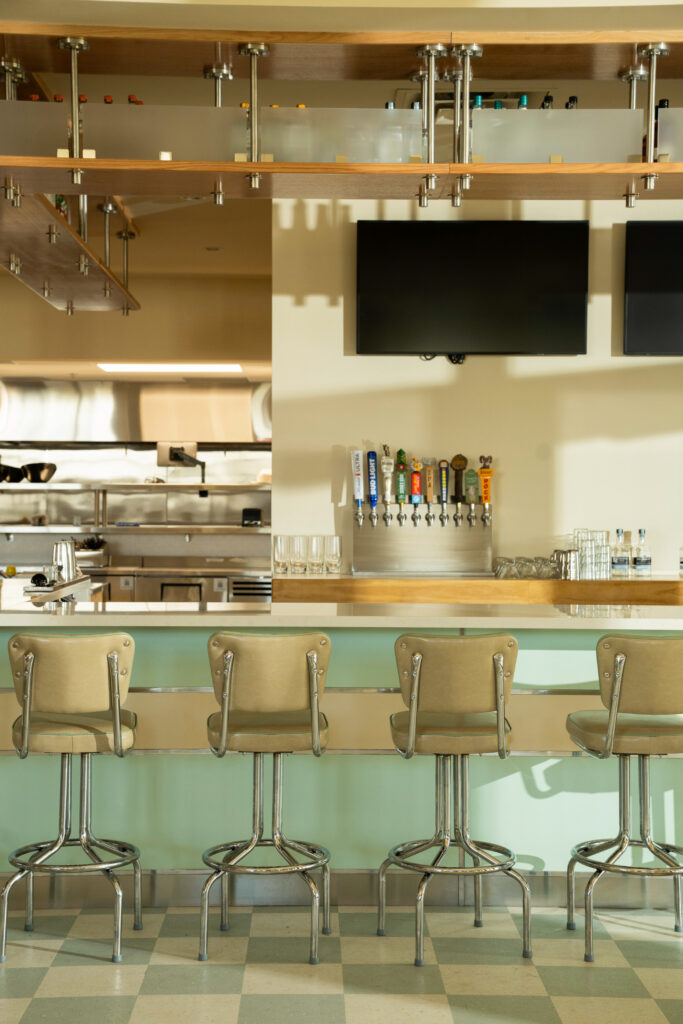 Green-and-white checkered flooring helps give “Mom’s kitchen” at A Little Shady its old-school diner look