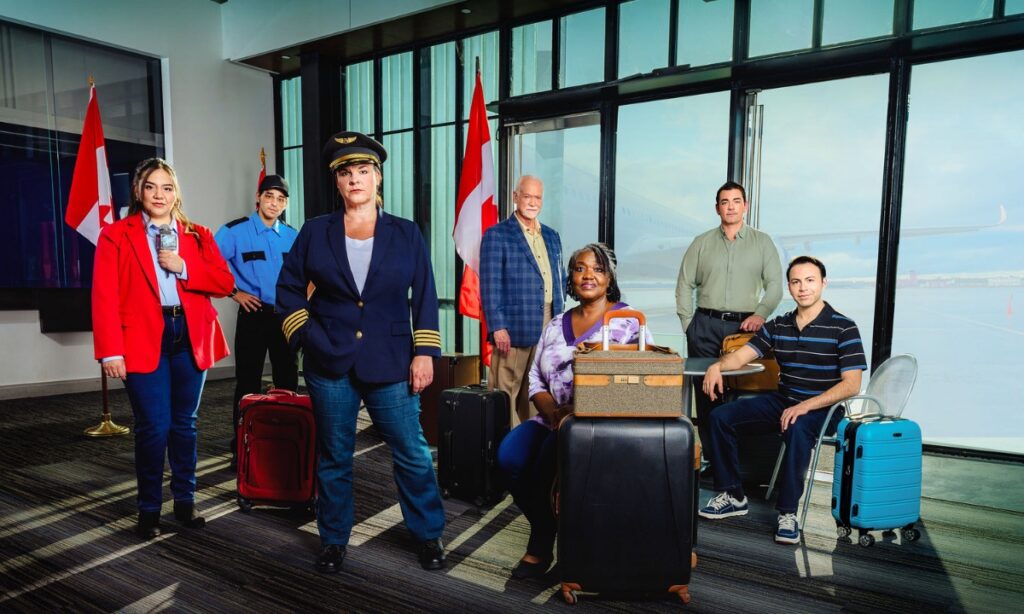 Cast photo of "Come From Away" featuring actors in an airport setting.