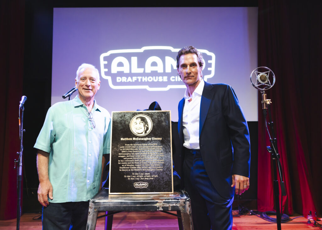 Austin Mayor Kirk Watson and Matthew McConaughey pose with the new Matthew McConaughey Cinema plaque