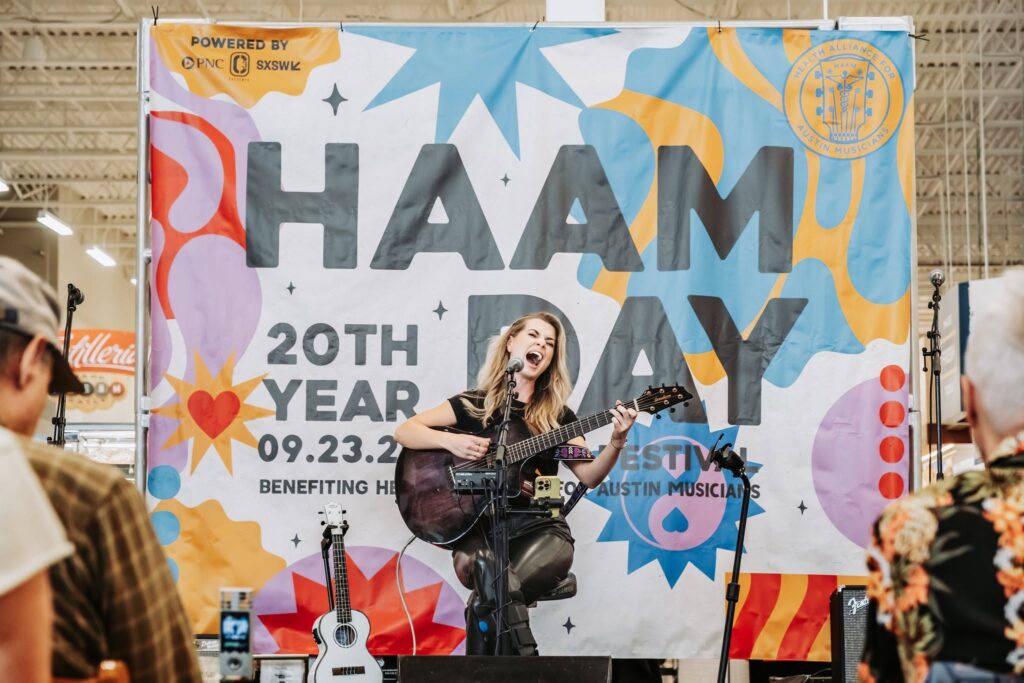 Musician performs during HAAM Day benefit event in Austin, Texas.