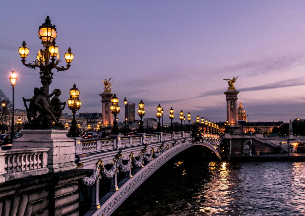Paris bridge at night along the Seine