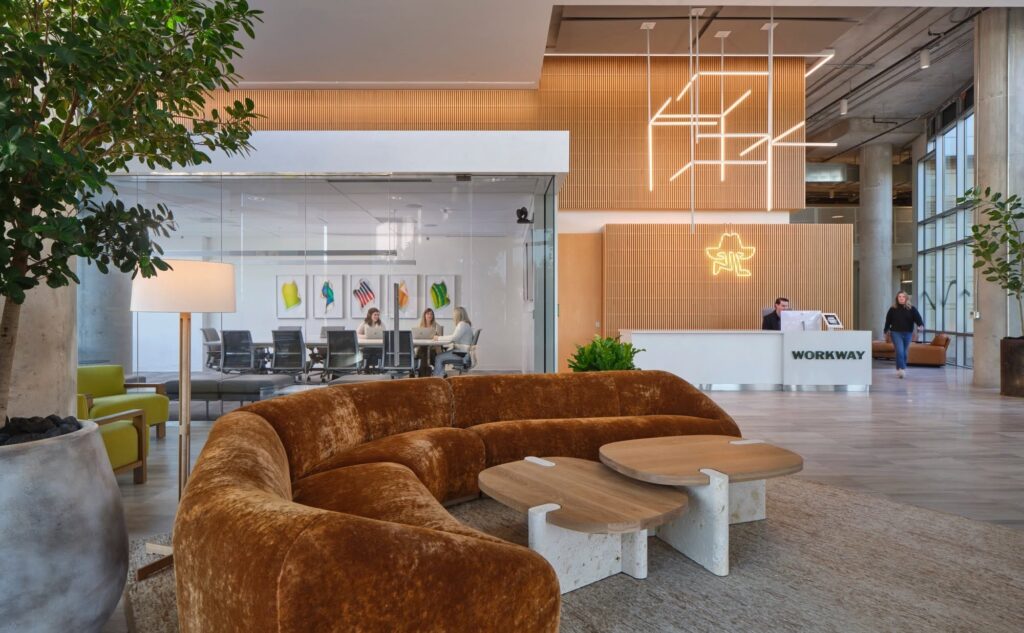 lobby at downtown Austin office space, featuring plush couch and office conference room