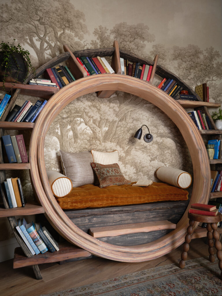 A hidden bookshelf opens to a hobbit-inspired reading nook in a Cedar Park home designed by Christina Cruz Interiors. (Photo by Cate Black)