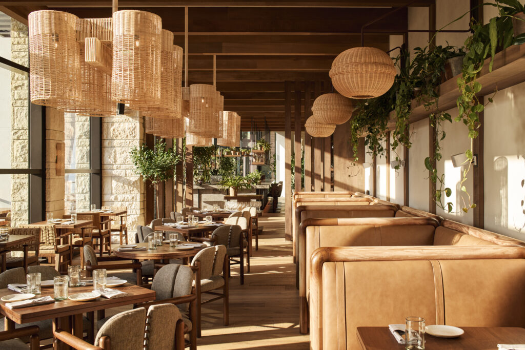 Sunlit dining room of Alteño restaurant at 1 Hotel Austin