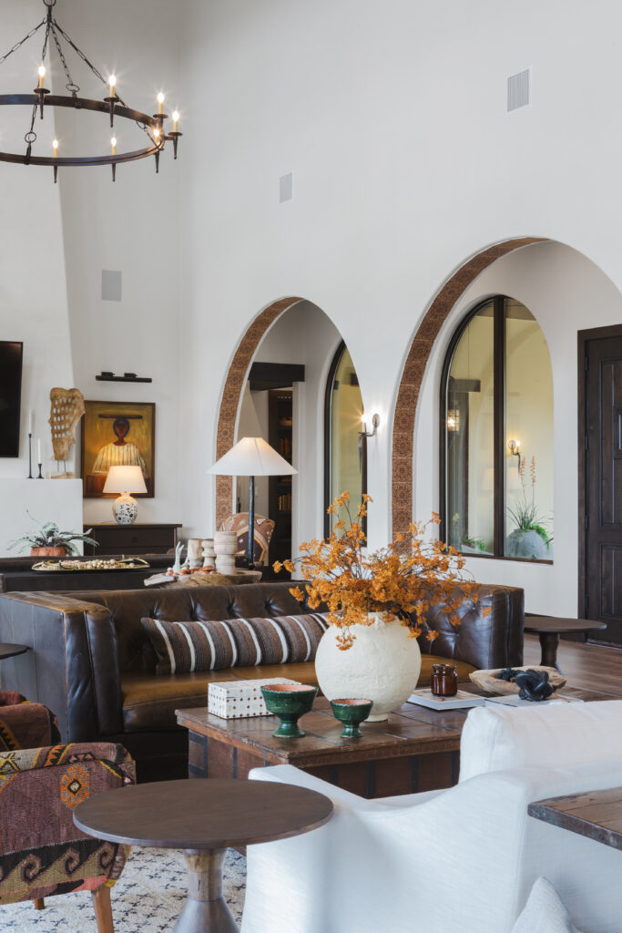 Restored vintage leather sofas and collected pieces in the living room. (Photo by Brittany Dawn Photography)