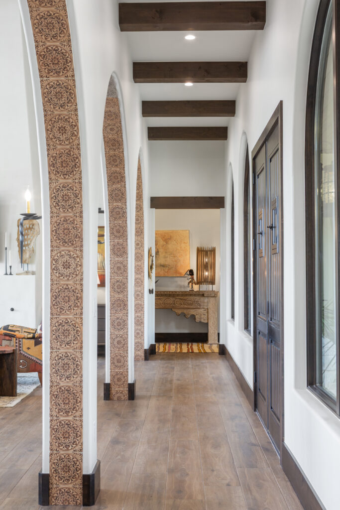 Patterned tile traces the hallway’s arches (Photo by Brittany Dawn Photography)