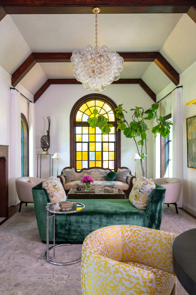 The home’s original stained-glass window remained the focal point as Hudson House updated the living room for family life. (Photo by Michael Hunter)