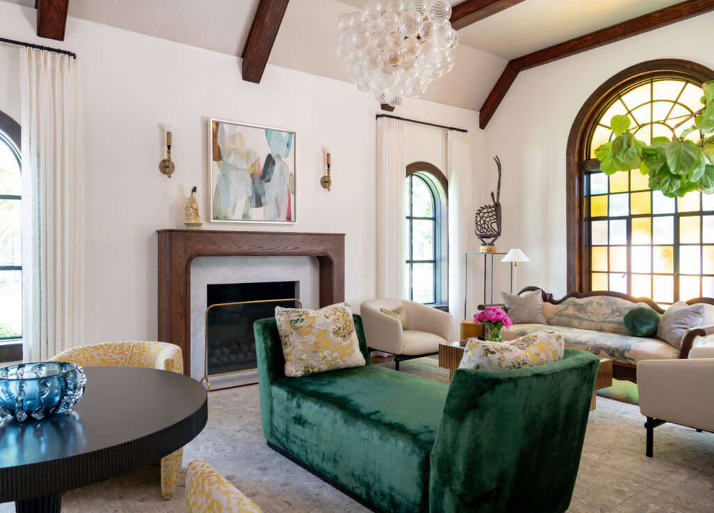After repairing several cracked panes, the team built the living room’s design around the 1930s stained-glass window. (Photo by Michael Hunter)