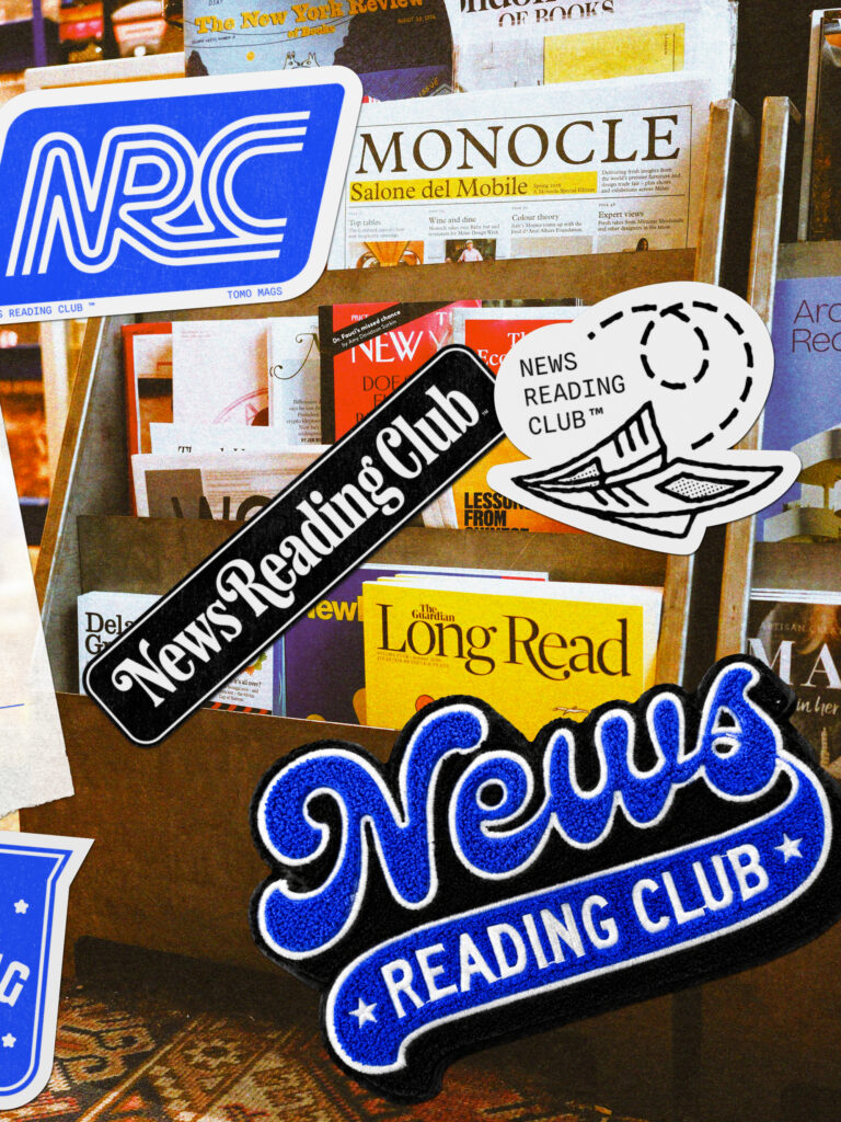 magazine and newspaper rack with stickers about the News Reading Club