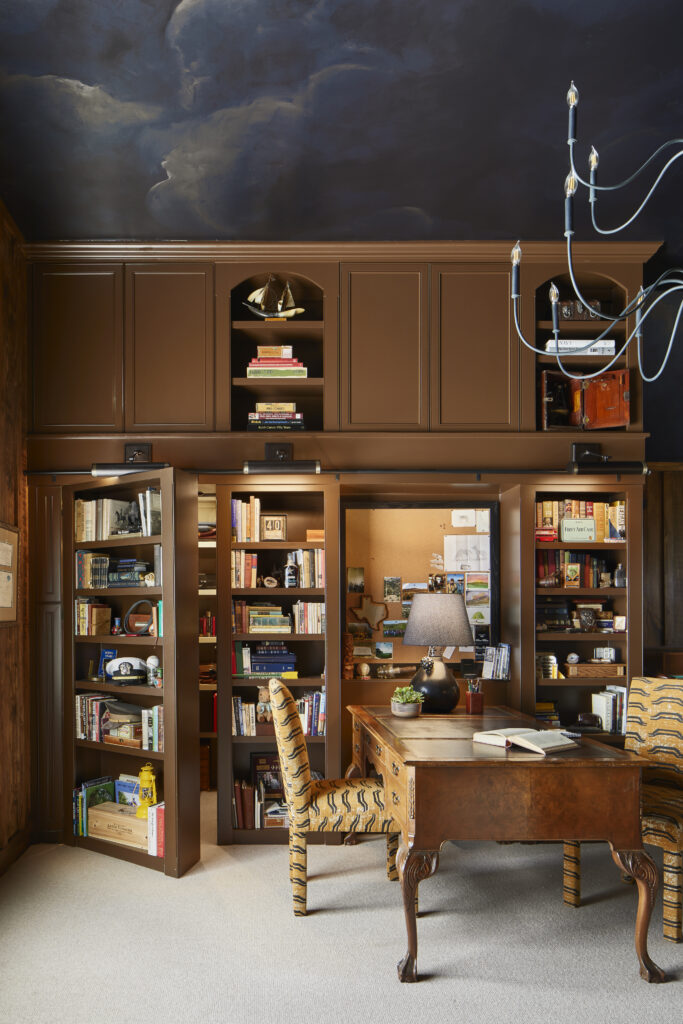 Amity Worrel & Co. drew on the owner’s West Texas roots for this Old West Austin home office, which features floor-to-ceiling bookshelves and a hidden door. (Photo by Andrea Calo)