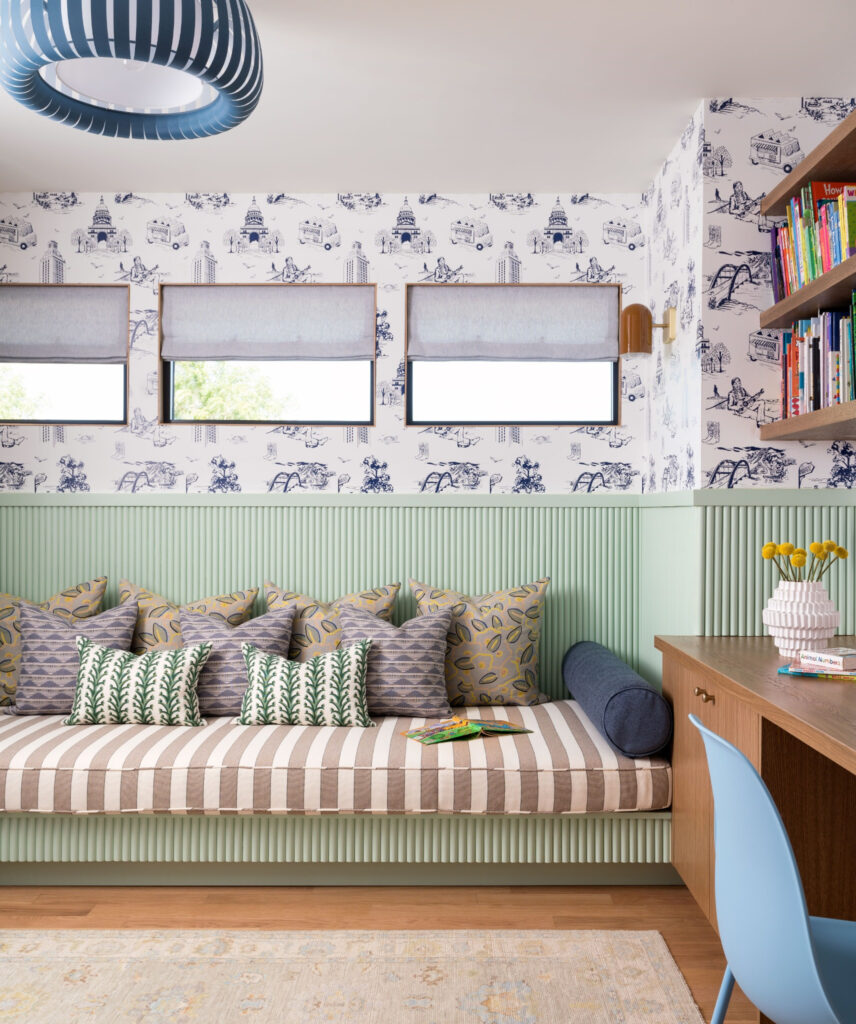 A daybed, built-in desks and Austin-themed wallpaper make room for reading and play in this Great Hills study designed by Etch Design Group. (Photo courtesy of Etch Design Group)