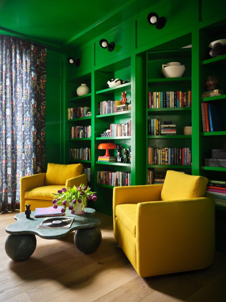 Austin FC green walls and sunny yellow chairs bring color to this home office by Annie Downing Interiors. (Photo by Lindsay Brown; styling by Adam Fortner)