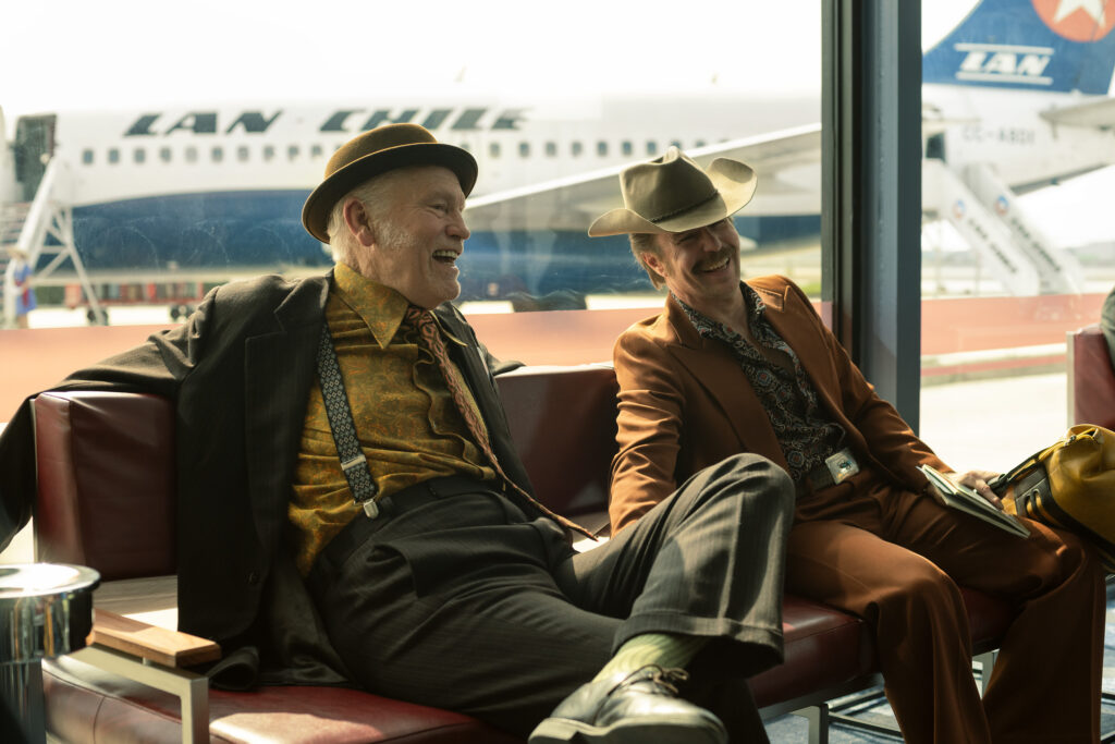 John Malkovich, left, and Sam Rockwell in “Wild Horse Nine.” (Photo by Diego Araya Corvalán/Searchlight Pictures)