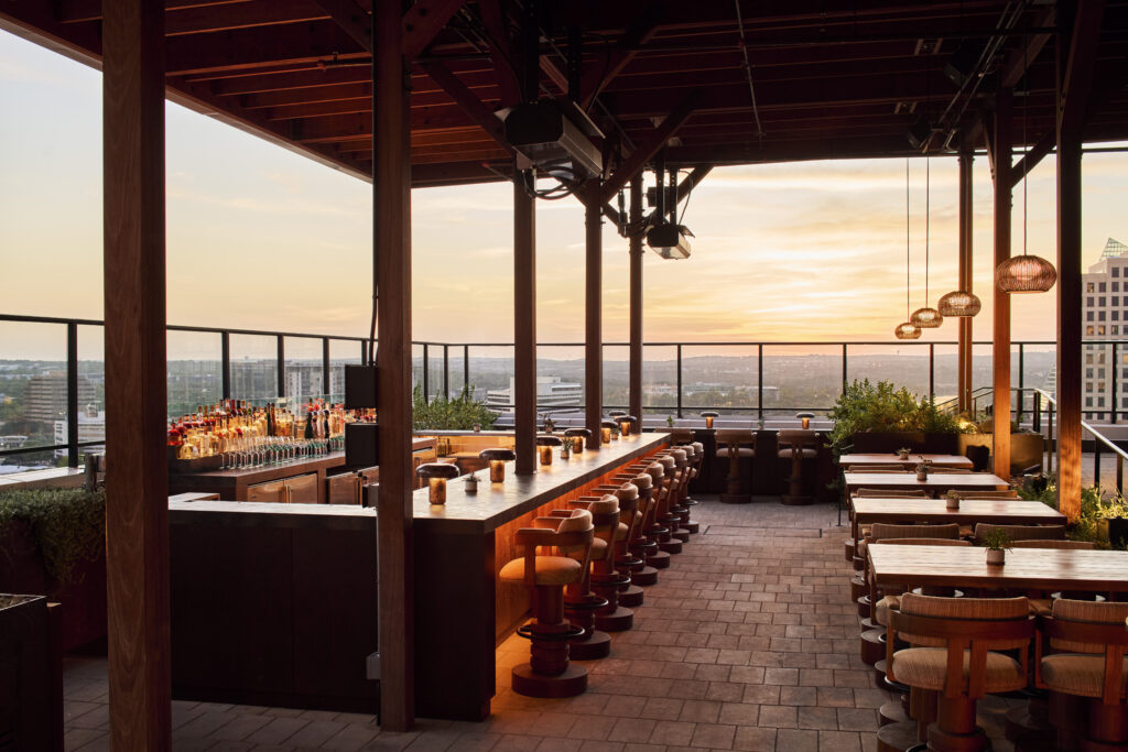 Sunset view over Austin, Texas at the 1 Hotel Austin's bar, watr.