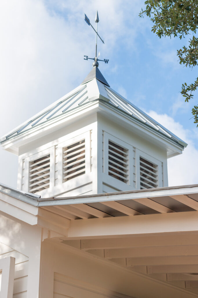 A functioning weathervane tops the carriage house’s cupola, one of the historic features preserved during the restoration.