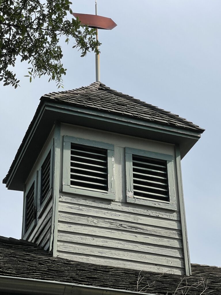 The carriage house’s cupola and weather vane before the restoration.