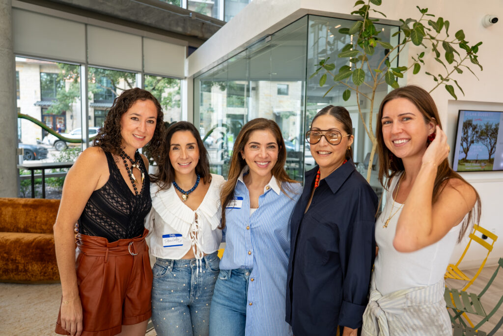 a group of women attending a fashion panel at Trick Hat Workway in Austin, Texas.